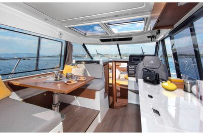 Jeanneau Merry Fisher 1095 - wheelhouse with port side seating and starboard side helm position and galley 